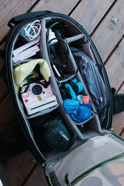 Photographer packing camera bag morning