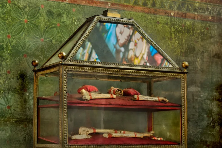 Glass reliquary displaying ancient scroll relics inside Lucca Cathedral museum