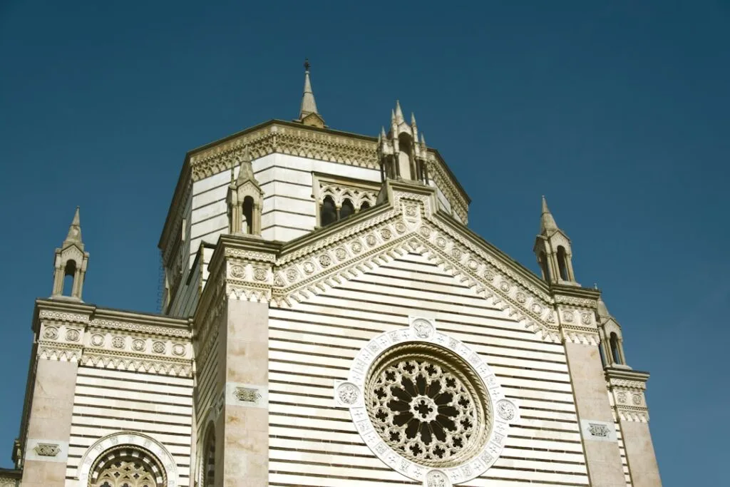 Striped marble façade and rose window of Lucca cathedral