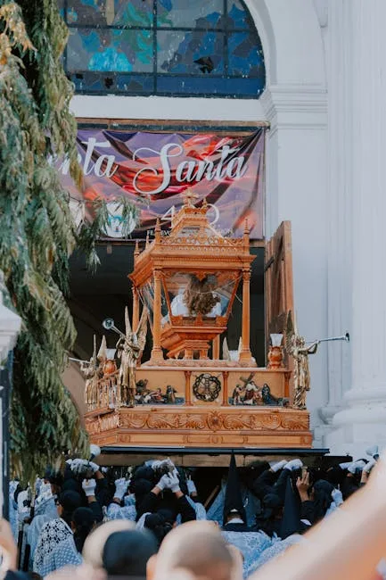 Devotees in procession carrying ornate wooden float during Lucca festival