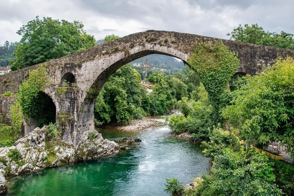 riverside thermal baths with stone bridge
