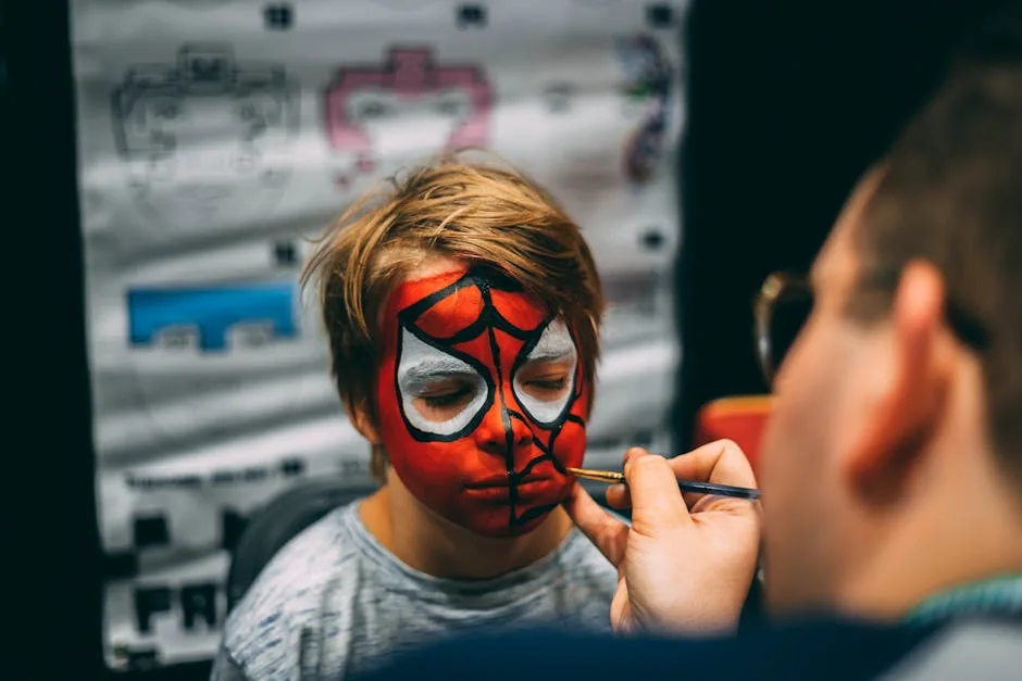 Child having Spiderman face paint applied at Lucca Comics children's station