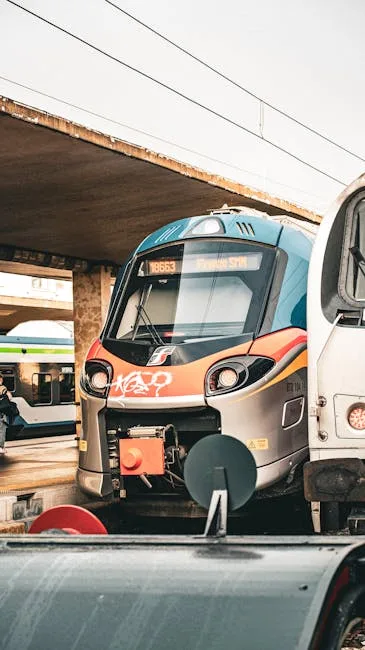 Modern regional train parked at an Italian station platform
