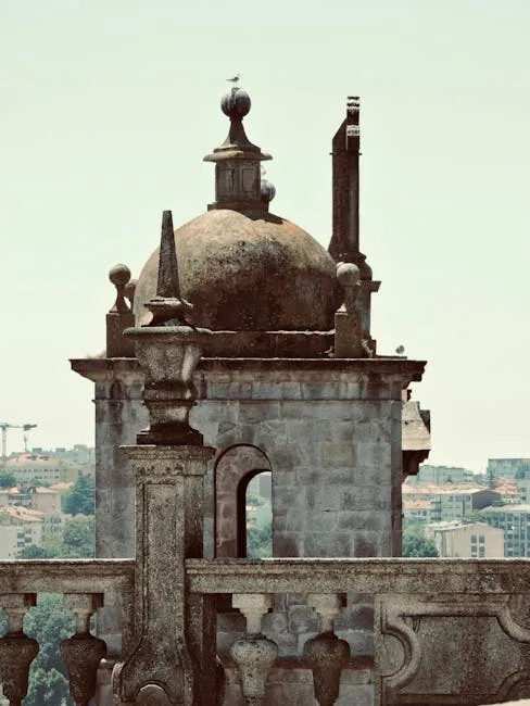 Ornate stone rooftop cupola and balustrade overlooking Lucca suburbs