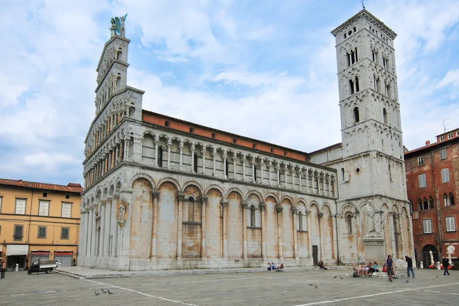 Wide view of Lucca's San Martino piazza with cathedral and visitors