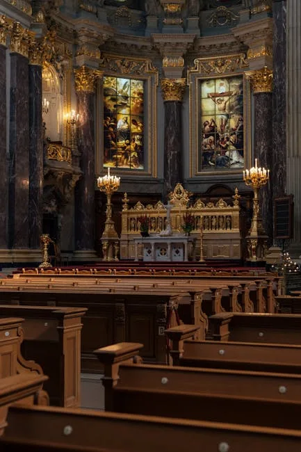 Ornate gilded altar and painted panels above wooden pews in Lucca
